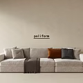 Modern Poliform Light Gray Three-Seater Sofa with Brown Dark Gray Accent Pillows and Throw Blanket