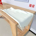 White Clothing Garment With Sheer Lace Fabric Placed On Wooden Table Surface
