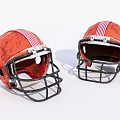 Two Orange Football Helmets With Red White Stripes And Black Facemasks