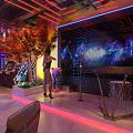 Elegant Modern Bar Interior With Neon Lights Bar Counter High Chairs And Wine Cabinets