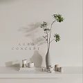 Stylish Home Decor Setup With Green Plant In Gray Vase And Candles
