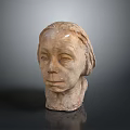 Artistic Clay Sculpture of Human Head with Detailed Facial Features and Expressions