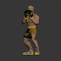 Muscular Man Wearing Black Yellow Boxing Gloves Yellow Shorts And Yellow Shoes In Fighting Stance