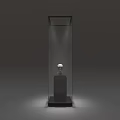 Black Display Cabinet Shelf with Top Lighting Holding White Sculpture on Black Base