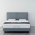Double Bed With Grey Upholstered Headboard And Comfortable Mattress In Modern Design