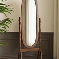 Wooden Frame Oval Standing Mirror With Green Plant And Curtain In Interior