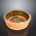 Hand Carved Ceramic Sculpture Bowl with Textured Exterior and Glazed Interior Design