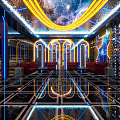 KTV Corridor With Black Walls Blue Neon Lights Mirror Decorations And Geometric Floor Tiles