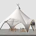 Outdoor White Tent Structure With Decorative Arch And Dining Tables Chairs On Stone Pavement