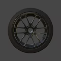 Black Car Wheel With Five Spoke Rim And Deep Tread Pattern 3d model