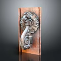 Antique Wooden Door Handle With Intricate Carved Floral Scroll Design On Wooden Base