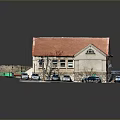 Small Stone Building With Red Roof And Parking Lot With Cars And Tree