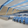 Modern Large Conference Room With Neatly Arranged Blue Gray Seats And Front Large Screen