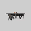 Modern Black Dining Table With Chairs Fruit Platter And Decorative Items