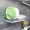 Kitchen Cabinets With Dish Rack Featuring Green White Plates And Wooden Spoons On Marble Countertop