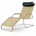 Modern Woven Rattan Lounge Chair With Metal Frame And Black Headrest