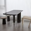 Modern Black Coffee Table With Metal Frame Stools And Chair Near White Blinds