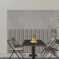 Modern Dining Table Set With Black Tabletop Four Woven Chairs And Yellow Fruits Bowl