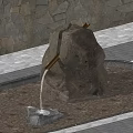 Serene Garden Landscape With Natural Stone Fountain Flowing Water And Paved Surroundings