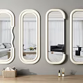 Four Decorative White Framed Oval Curved Mirrors On Gray Wall With Wooden Floor