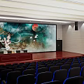 Conference Room With Large Screen Lady Red Sun Flying Birds Podium Wooden Floor Black Chairs