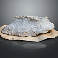 Natural Wooden Board Supporting Textured Stone Piece With Organic Patterns And Earthy Tones