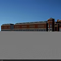 Red Brick Commercial Street With Classical Towers Arched Entrance And Multiple Windows