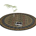 Round Decorative Rug With Floral Pattern Gold Red Blue Colors Small Plant And Magazines On Top