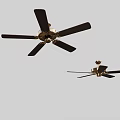 Two Different Black Blade Ceiling Fans With Gold Motor Modern Design For Home Use