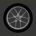 Motorcycle Black Tread Tire With Silver Spoke Wheel Rim And Glossy Reflection