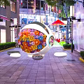 Decorative Spherical Structure Adorned With Colorful Flowers Near Storefront With Transparent Bases