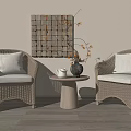 Cozy Rattan Leisure Chairs With Beige Cushions Small Wooden Table Vase And Patchwork Wall Decor