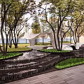 Modern Openwork Pergola In Outdoor Garden With Green Lawn And Trees