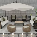 Outdoor Wicker Sofa Set Featuring White Parasol Coffee Table Round Stools And Green Plants