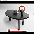 Modern Black Oval Desk With Laptop Table Lamp And Orange Chair