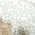 Raindrops On Window Glass With Blurred Outdoor Background View