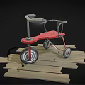Children's Red Toddler Walker With Four Wheels On Wooden Planks