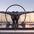 Modern Metallic Sculpture With Outstretched Arms Circular Halo On Reflective Pool Base Against Sunset Sky