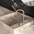 Modern Bathroom Washbasin With Black Marble Wall Oval Mirror And Beige Countertop