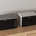 Two Sharp Stainless Steel Microwaves As Modern Kitchen Appliances On Wooden Countertop