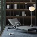 Modern Gray Lounge Chair With Geometric Cushion And Round Floor Lamp By Dark Bookshelf