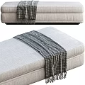 Gray Fabric Ottoman With Cozy Knitted Blanket On Top For Living Room