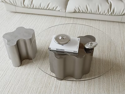 Modern Coffee Table With Transparent Glass Top And Sculptural Metal Base In Cream Living Room 3d model