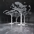 Intricately Carved White Tree Sculptures Featuring Twisted Trunks And Complex Roots