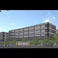 Modern Multistorey Industrial Factory Building With Glass Facade And Surrounding Greenery