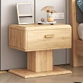 Wooden Bedside Table Next to Bed With Photo Frame Dried Flowers And Mug On Top