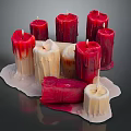 Red and Cream Melted Candles With Irregular Shapes and Wax Drips on Base