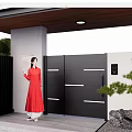 Modern Black Gate With White Walls Green Plants And Decorative Stone