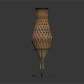 Green Plant In Modern Brown Hollow Out Vase With Metal Stand On Dark Background