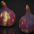 Two Fresh Juicy Striped Purple and Yellow Figs on Black Background